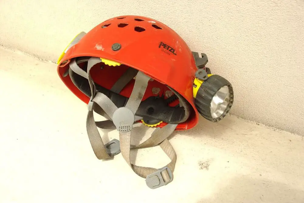 Photo of a PETZL caving helmet with DUO headlamp