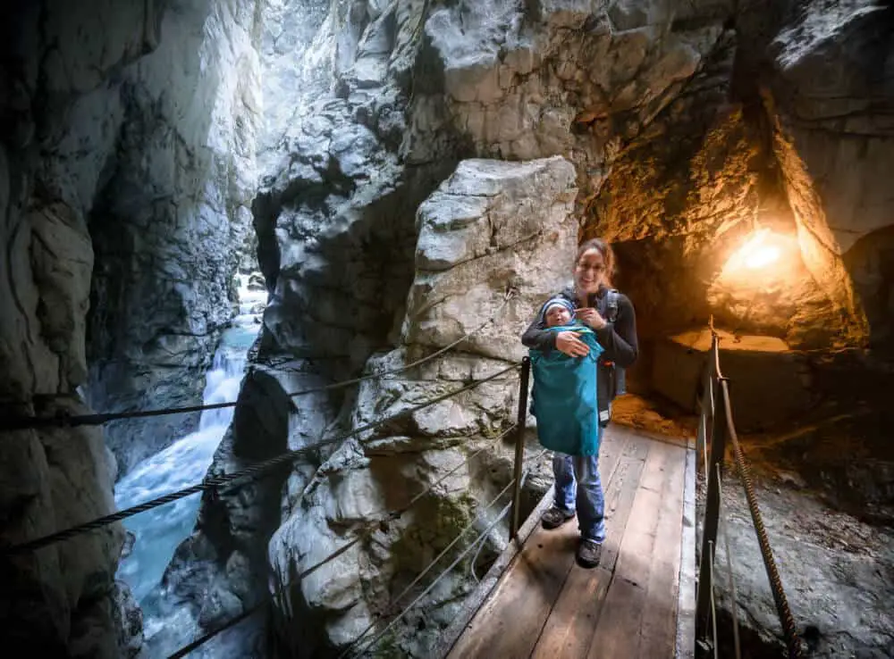 A woman and a child inside a show cave