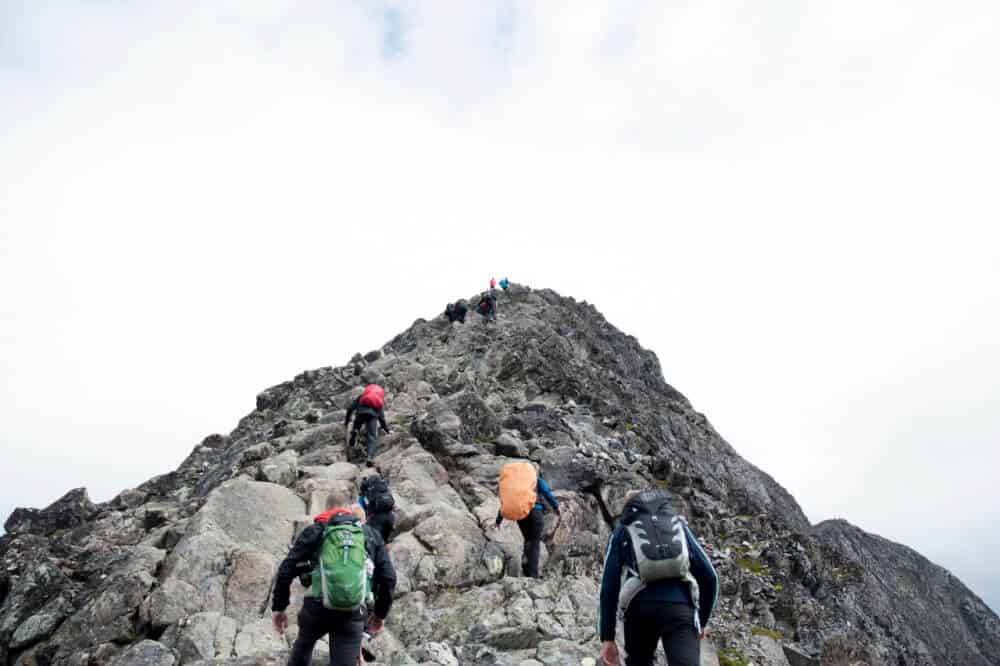 People running up a hill