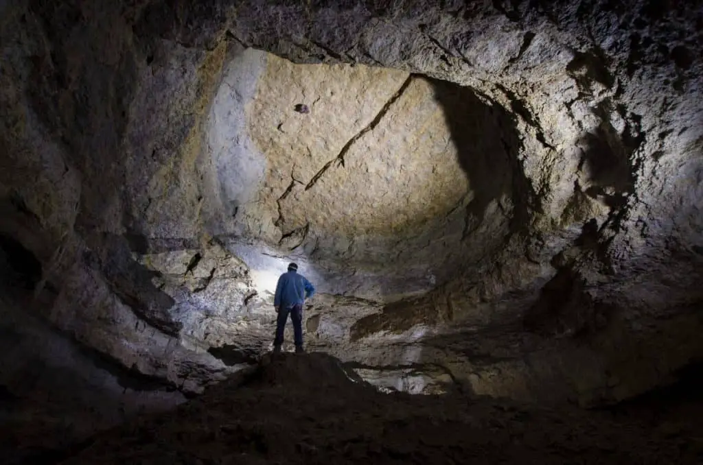 Man standing in a huge cave